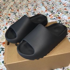 Yeezy Slide made by Adidas. Size 7M/8.5W. Onyx